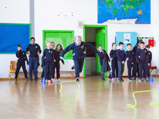 Children doing PE in school